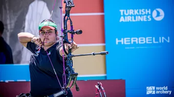 Andrea Becerra aiming.