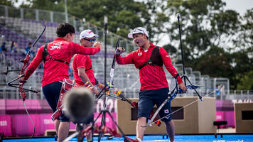 The Japanese men's team celebrates at the Tokyo 2020 Olympic Games. 