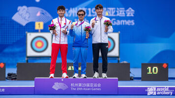 The recurve men’s podium at the Asian Games.