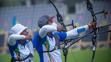 Deepika Kumari and Atanu Das warm up during stage three of the 2021 Hyundai Archery World Cup in Paris.