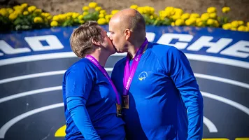Lina Bjorklund and Erik Jonsson celebrate winning pairs world title.