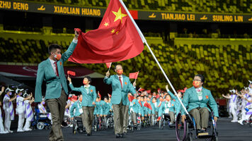 Zhou Jiamin carries China’s flag during the opening ceremony at the Tokyo 2020 Paralympic Games.