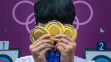 An San with her three Olympic gold medals.