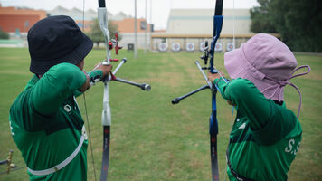 Female archers shooting in Saudi Arabia.