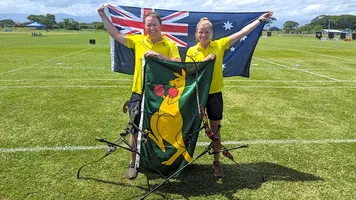 Ryan Tyack and Laura Paeglis celebrate winning an Olympic quota for Australia.
