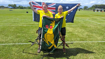 Ryan Tyack and Laura Paeglis celebrate winning an Olympic quota for Australia.