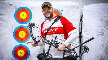 Schloesser poses with 25-metre record face.