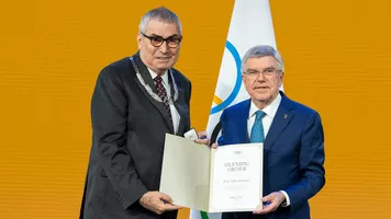 Prof Dr Erdener receives his Olympic Order in Olympia.