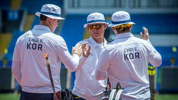 Korea compound men team celebrating.