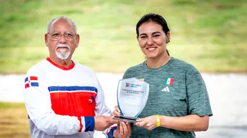 Alejandra Valencia being awarded the Copa Merengue.