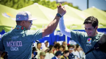Matias Grande and his coach David Velez celebrating. 