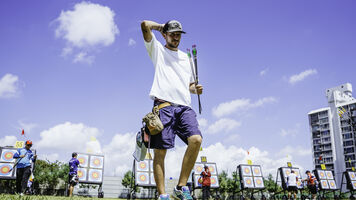 Nicolas Girard scratching his head on the field.