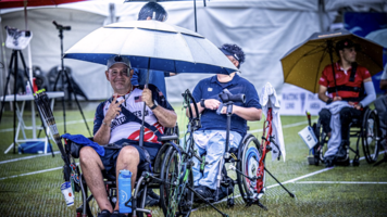 Jason Tabansky posing for a photo in the rain at Gwangju. 