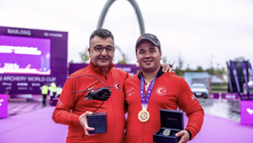 Emircan Haney celebrating his win with his coach Mehmet Ejder Sozen.
