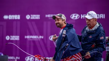 Brady Ellison smiling. 