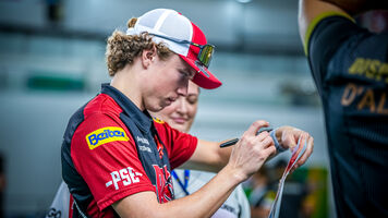 Mathias Fullerton signing a target.