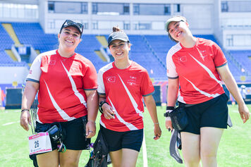 Archer poses after their rounds