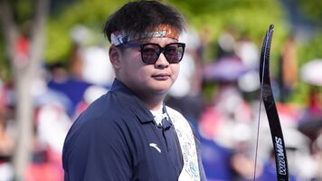 Li Mengqi staring down at the camera during his gold medal match at Shanghai 2026.