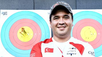 Emircan Haney posing next to his final end of six Xs.