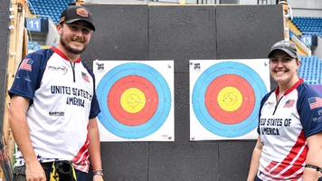 James Lutz and Alexis Ruiz smiling at their winning targets at Shanghai 2026. 