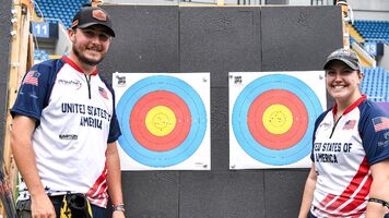 James Lutz and Alexis Ruiz smiling at their winning targets at Shanghai 2026. 
