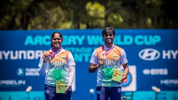 Kumkum Anil Mohod and Dhiraj Bommadevara holding up their gold medals at Antalya 2026.