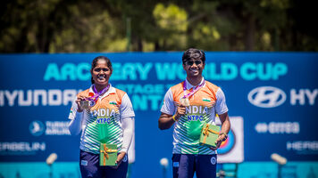 Kumkum Anil Mohod and Dhiraj Bommadevara holding up their gold medals at Antalya 2026.