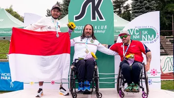 Archers pose on podium