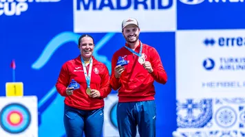 Elia Canales and Andres Temino Mediel on the recurve mixed team top podium at Madrid 2026.