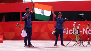 Athletes celebrate with country flag