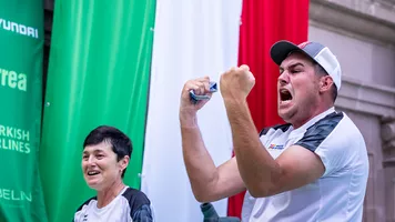 Bettina and Nico Wiener celebrating after winning the 2026 compound men World Cup Final. 