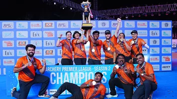 Athletes celebrate with trophy after their victorious campaign 